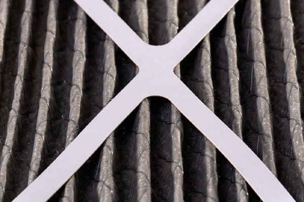 image of a dirty hvac filter that needs a replacement for cooling system efficiency
