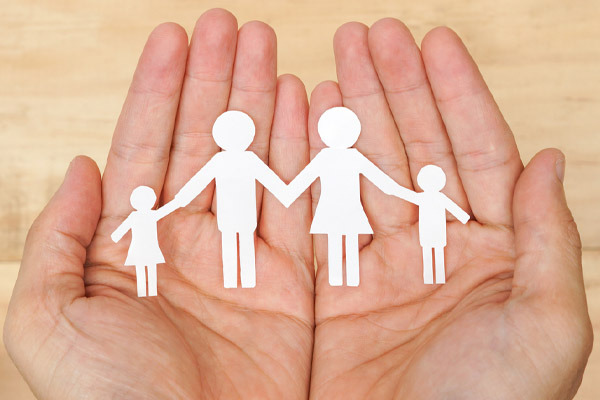 image of hands holding family depicting heating system safety