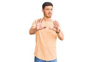 man looking worried doing a stop hand gesture for DIY AC maintenance