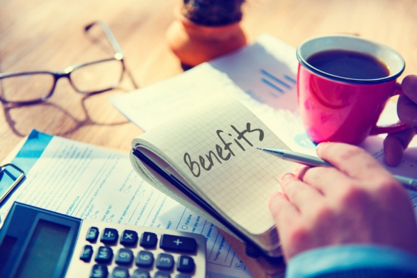 Benefits written on a notepad depicting financial and energy benefits