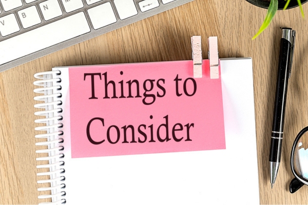 Notebook with text THINGS TO CONSIDER depicting Air Conditioner Repair Vs Replace