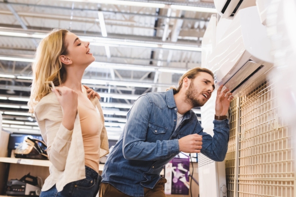 couple choosing a ductless HVAC system for the house