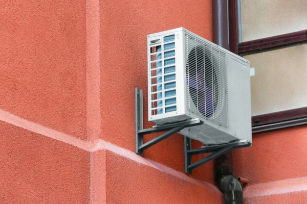 ductless HVAC installed on a red wall