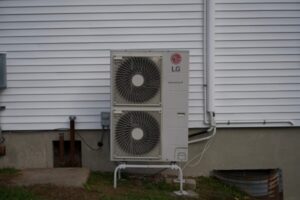 ductless HVAC outdoor unit installed at the back of the house
