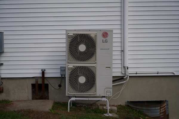 ductless HVAC outdoor unit installed at the back of the house