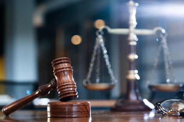 image of a judge's gavel and scale depicting legal and regulatory framework