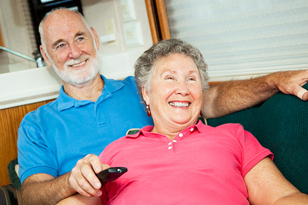 Couple Relaxing Comfortably With New Boiler Installation
