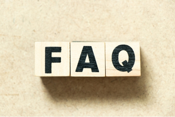FAQ spelled using wooden letter cubes depicting questions about air conditioner not removing humidity