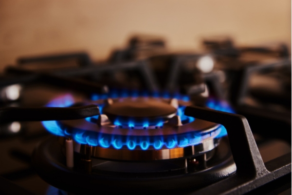 close up of blue flame on propane stove burner
