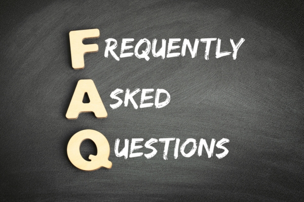 frequently asked questions written on a chalkboard depicting FAQs about Choosing the Right Energy Kinetics Boiler