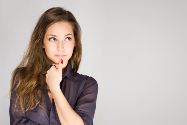 image of a woman with hand on chin thinking if Energy Kinetics System 2000 Is It Worth the Investment