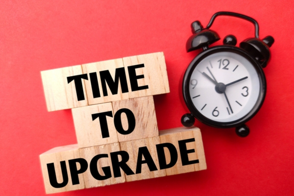 time to upgrade beside an alarm clock depicting signs it's time for a boiler upgrade
