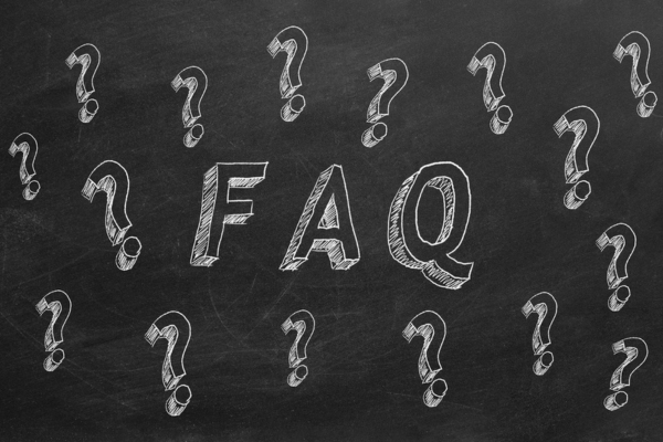 FAQ written on a chalkboard with question mark doodles depicting questions about portable air conditioner
