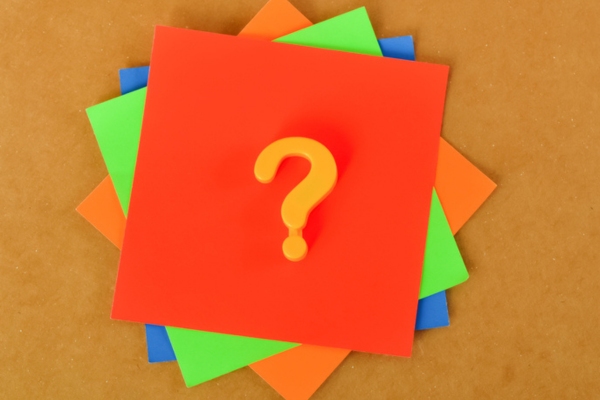 question mark on a stack of colored papers depicting FAQS about painting propane tank