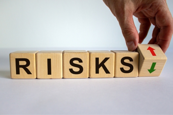 RISKS spelled using wooden letter cubes depicting DIY HVAC Blower Motor Repairs