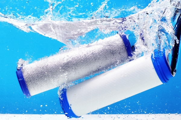 carbon filter cartridges for house water filtration submerged in water