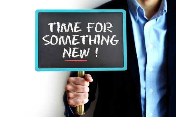 man holding Time for something new sign depicting garbage disposal replacement