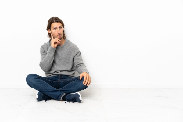 image of man sitting on the floor thinking about the distinction between on-road and off-road diesel