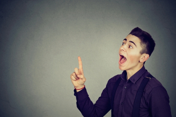 man pointing up with his mouth open depicting understanding the Role of a Heating Oil Filter