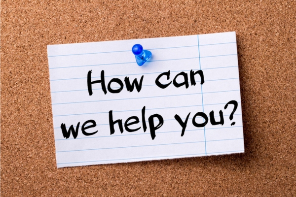 How can we help you note pinned on a corkboard