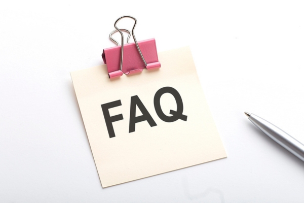 FAQ written on a small paper with a metal clip on top depicting Heating Oil Delivery Service questions