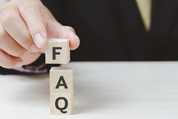 FAQ spelled using wooden letter cubes depicting HVAC Maintenance Agreements