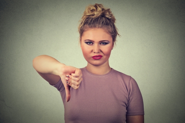 woman doing a thumbs down depicting Major Remodeling is Required