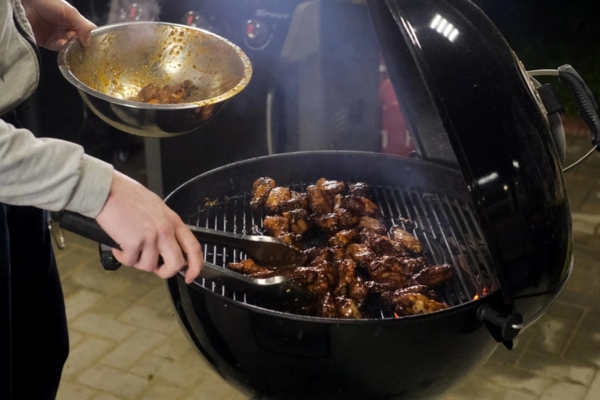 homeowner grilling with propane