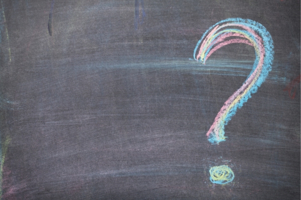 question mark written on a chalkboard depicting Summer Plumbing Problems FAQs