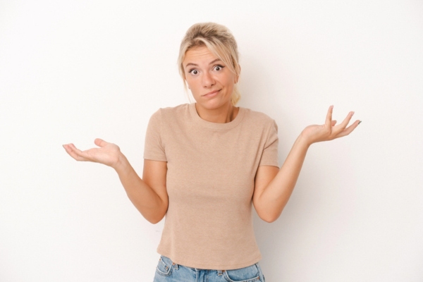 woman shrugging asking what causes weak air conditioner flow