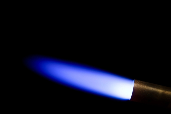 blue flame from a gas burner depicting furnace ignitor