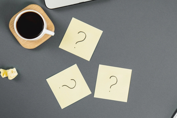 question marks written on sticky notes depicting FAQs about Water Heater for Winter