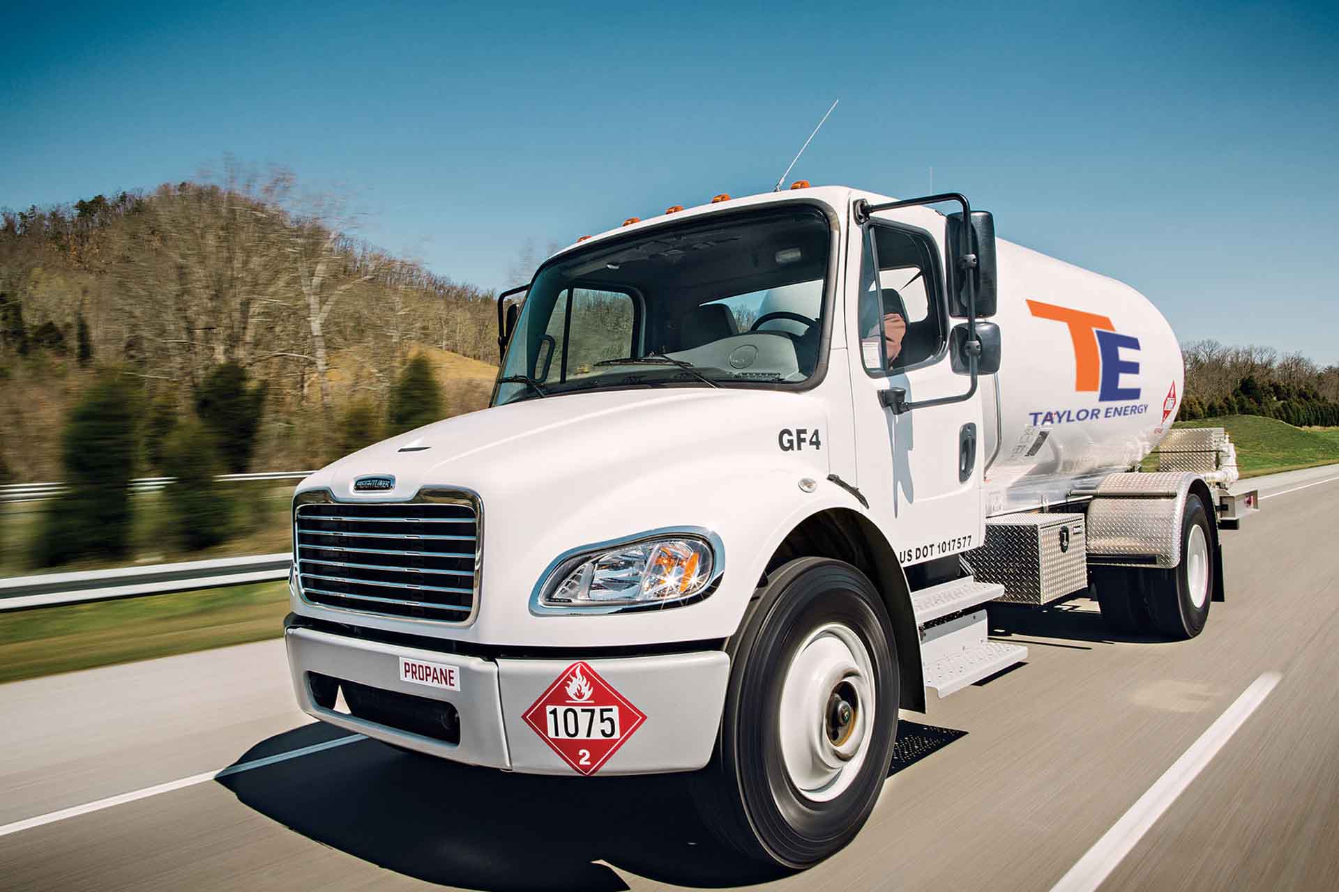 Enfield, CT propane delivery truck driving on a highway