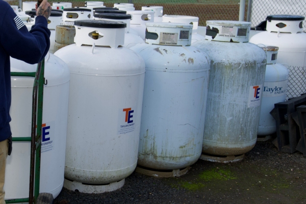 Enfield, CT propane tanks lined up for refill service at a propane dealer