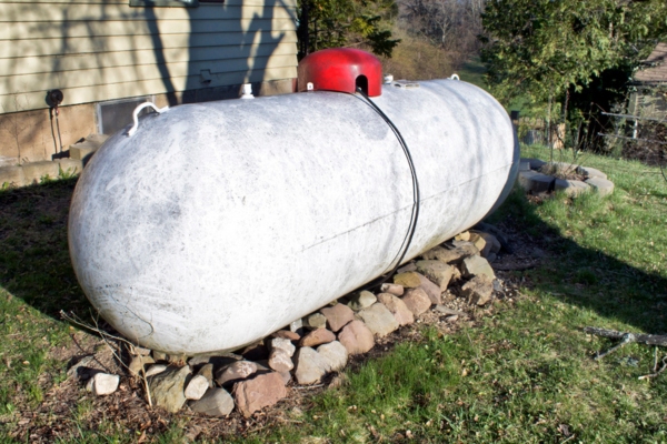 Enfield, CT residential propane tank installed on a stone base in a yard
